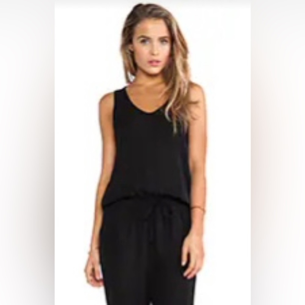 NWOT Theory 100% silk jumpsuit from Neiman’s. Great black sleeveless w/pockets